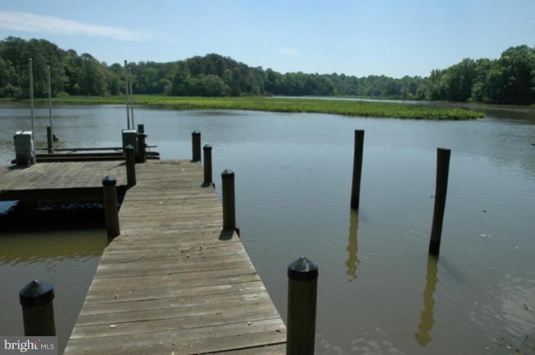 1801 Hatfield Road Huntingtown, MD 20639 - Photo 5 of 19 a view of a lake with large trees