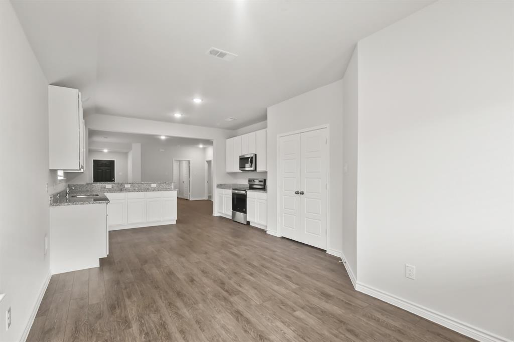 1607 Romans Road Ennis, TX 75119 - Photo 6 of 15 a view of kitchen with wooden floor