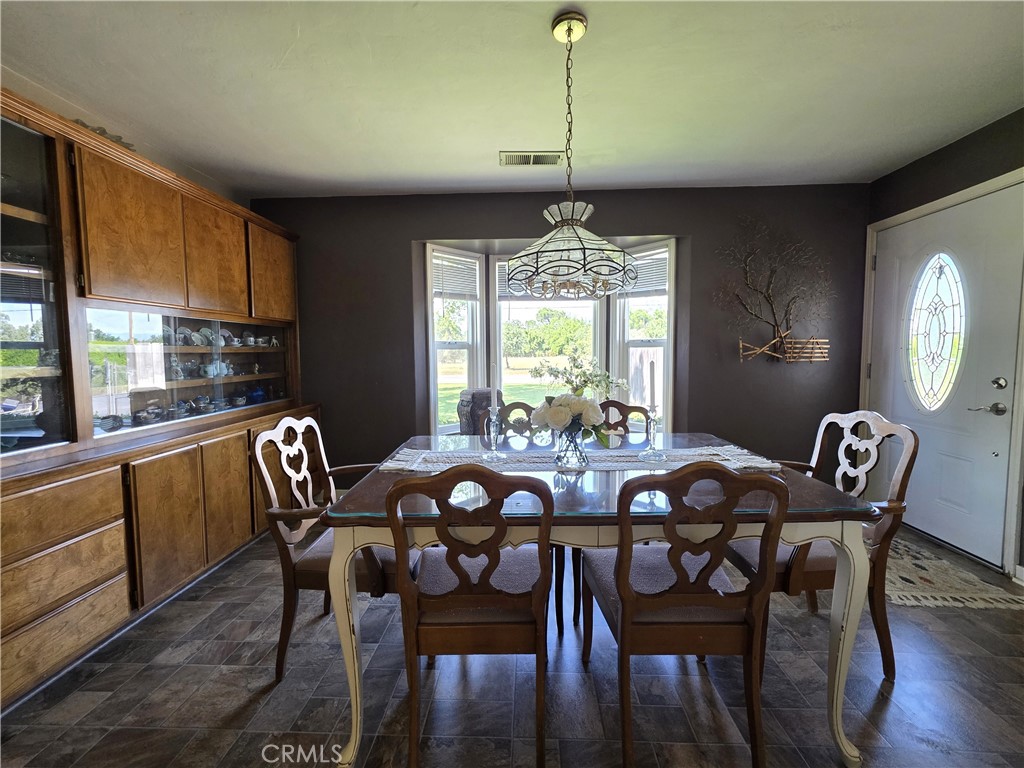 23773 River Road Corning, CA 96021 - Photo 11 of 64 a view of a dining room with furniture window and outside view