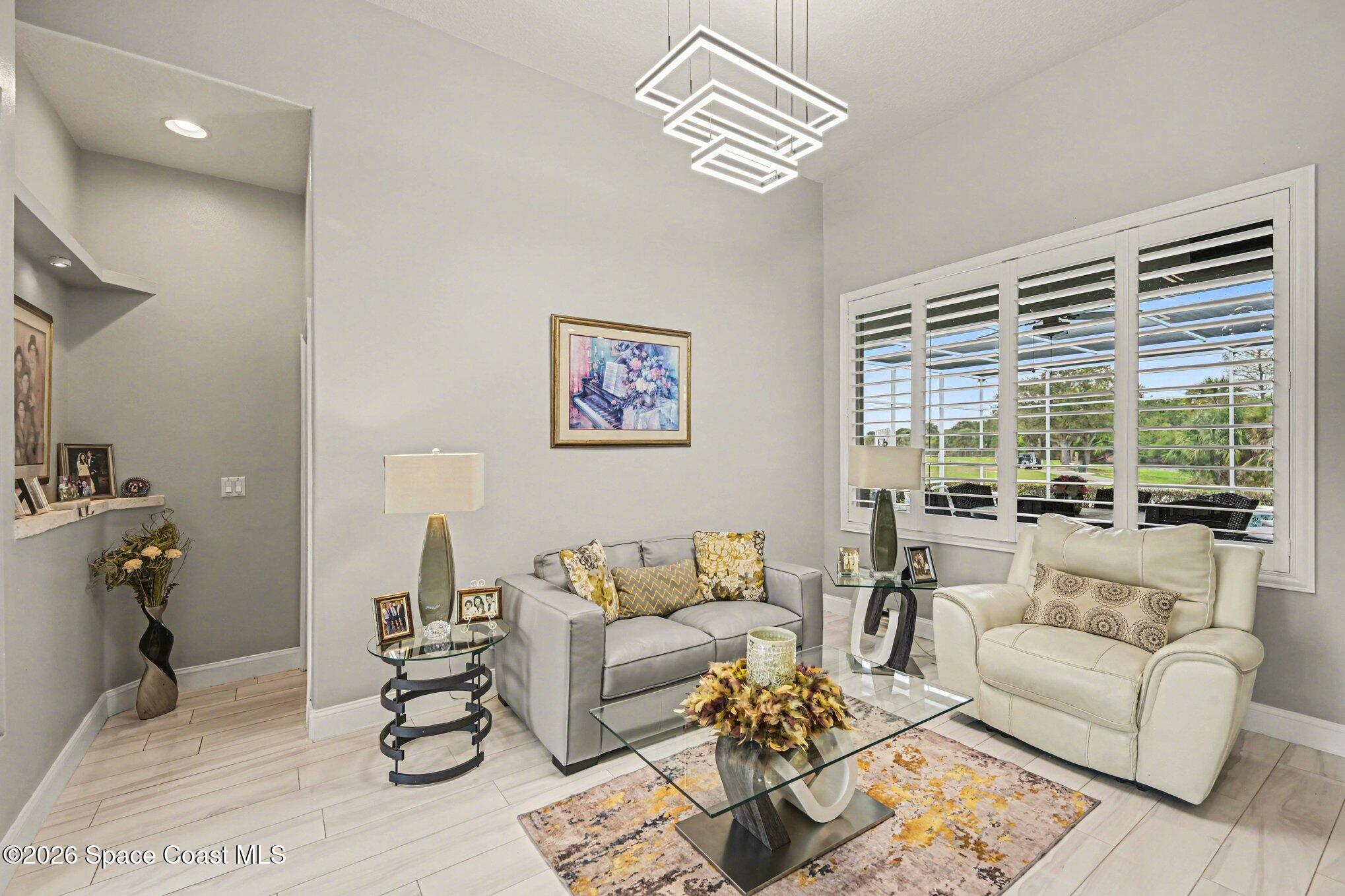 4317 Collingtree Drive Rockledge, FL 32955 - Photo 11 of 64 a living room with furniture and a large window