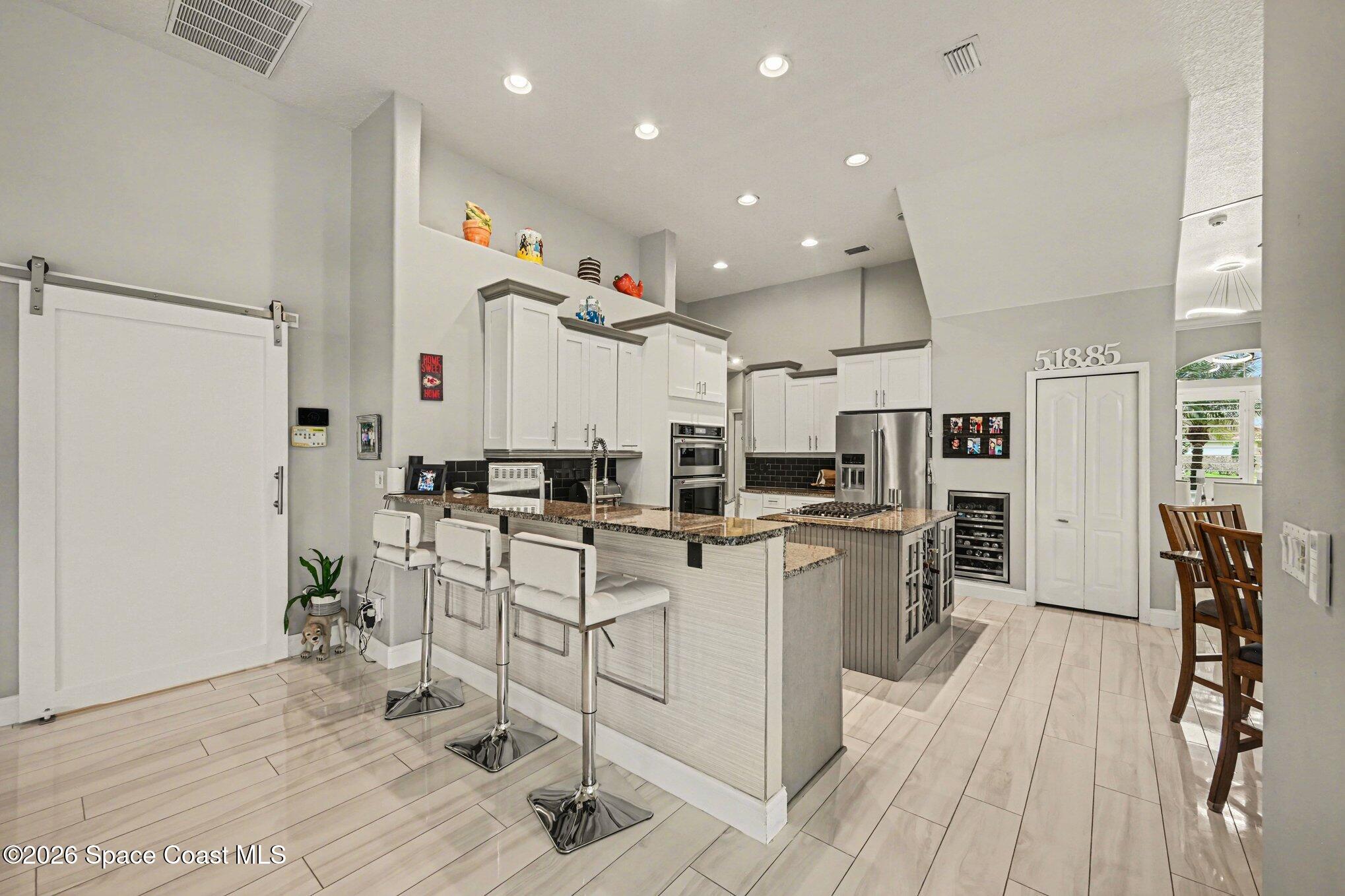 4317 Collingtree Drive Rockledge, FL 32955 - Photo 16 of 64 a kitchen with white cabinets and sink