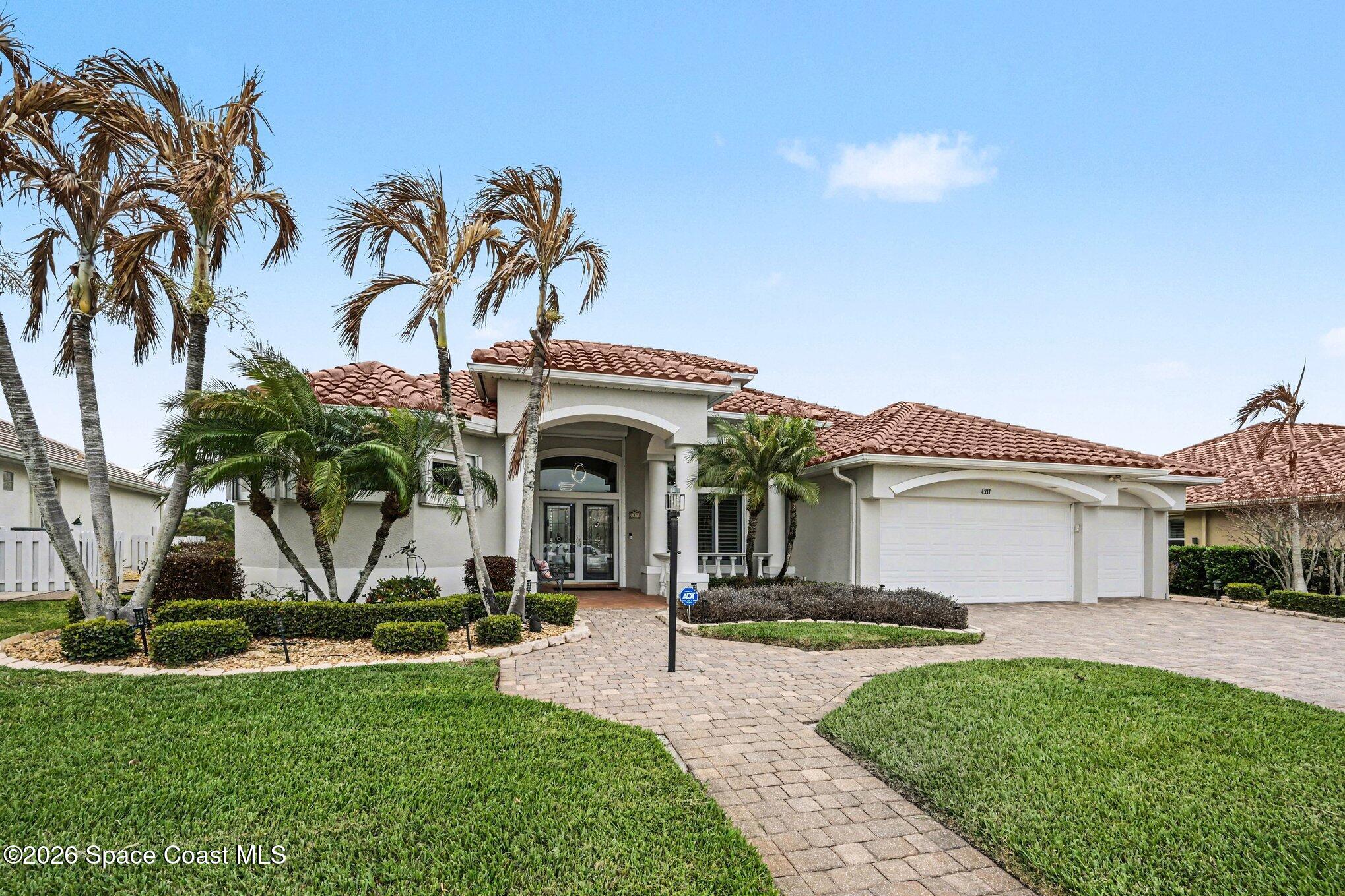 4317 Collingtree Drive Rockledge, FL 32955 - Photo 2 of 64 a view of a house with potted plants and palm trees