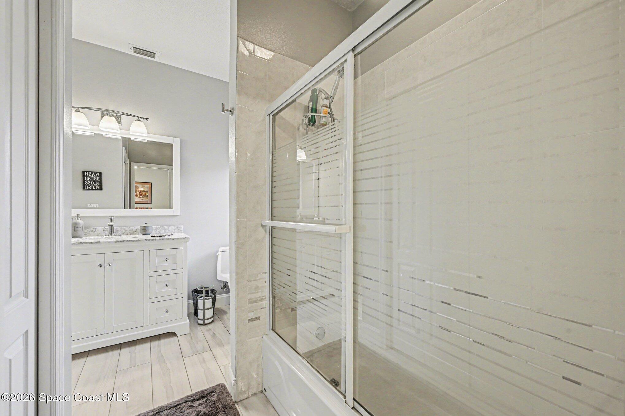 4317 Collingtree Drive Rockledge, FL 32955 - Photo 34 of 64 a bathroom with a shower and a sink