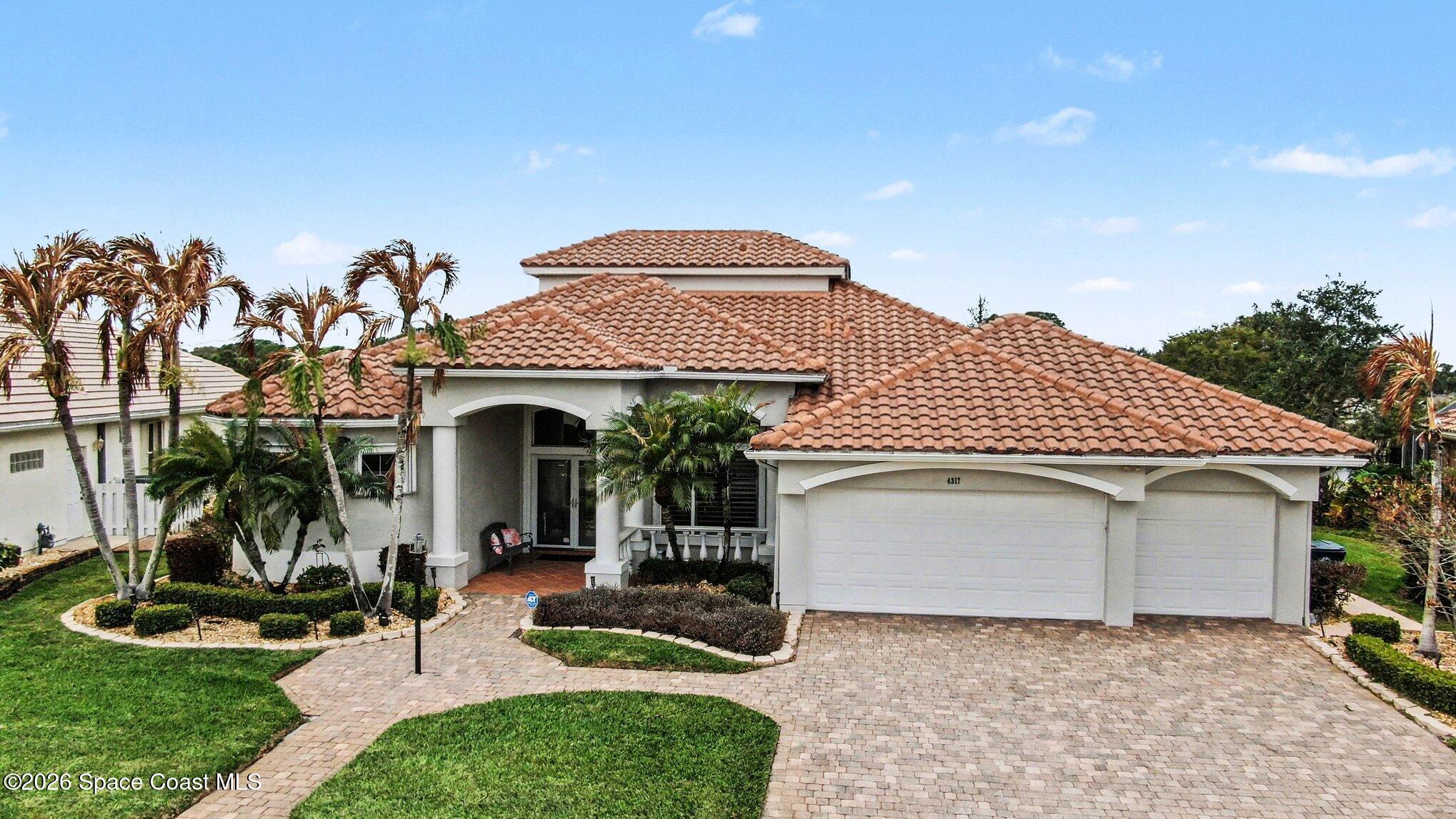4317 Collingtree Drive Rockledge, FL 32955 - Photo 4 of 64 a front view of a house with garden