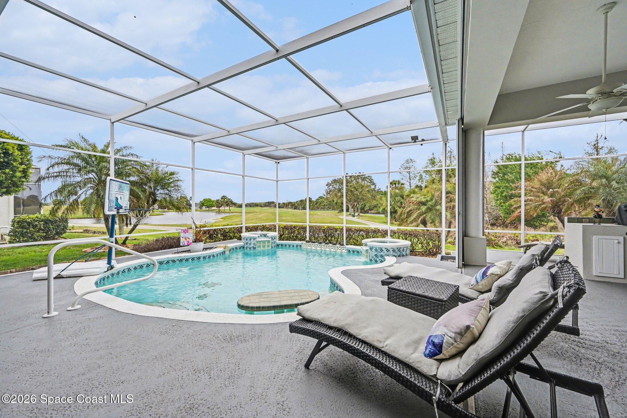 4317 Collingtree Drive Rockledge, FL 32955 - Photo 46 of 64 a dining room with furniture and floor to ceiling windows