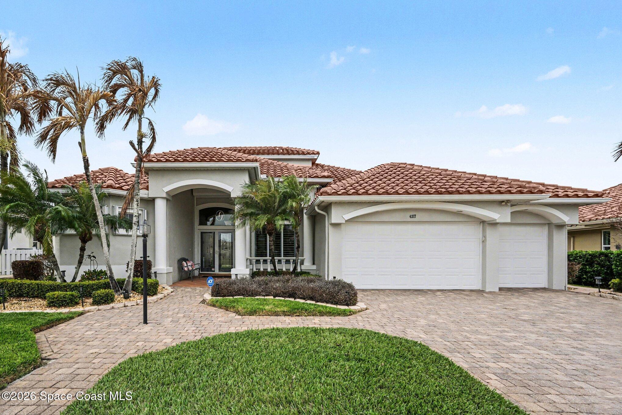 4317 Collingtree Drive Rockledge, FL 32955 - Photo 5 of 64 a view of a white house with a yard and palm trees