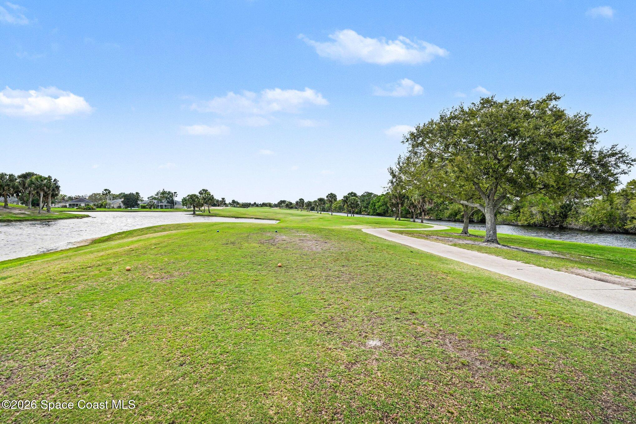 4317 Collingtree Drive Rockledge, FL 32955 - Photo 55 of 64 a view of a lake with a big yard