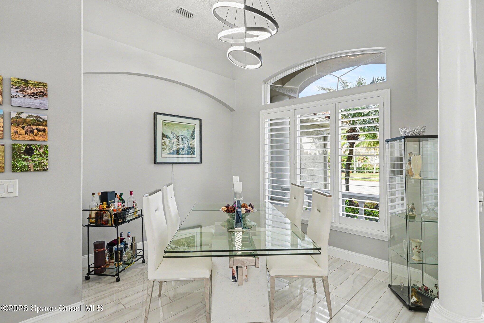 4317 Collingtree Drive Rockledge, FL 32955 - Photo 8 of 64 a dining room with furniture and window