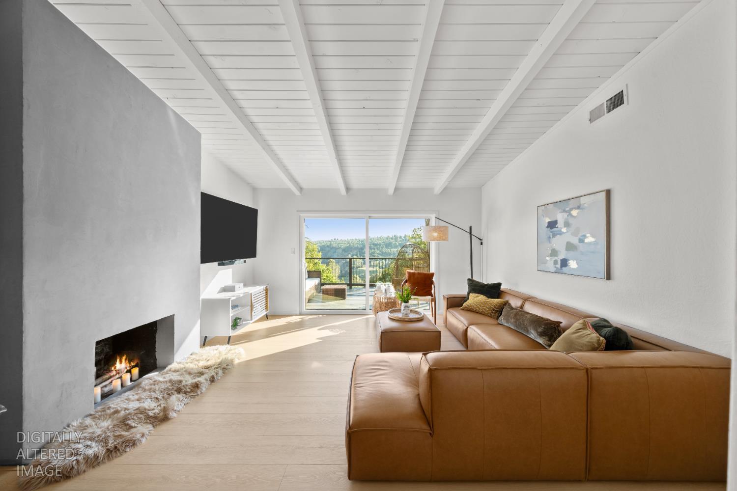 140 Rio Camino Street Auburn, CA 95603 - Photo 11 of 56 a living room with furniture a flat screen tv and a fireplace