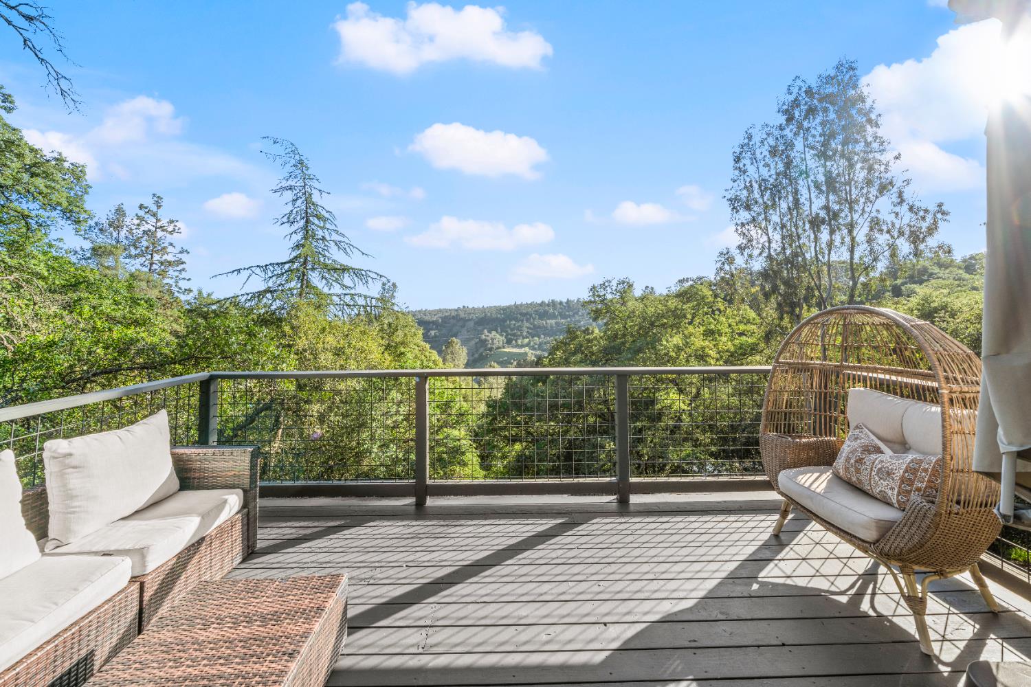 140 Rio Camino Street Auburn, CA 95603 - Photo 16 of 56 a view of balcony with wooden floor and seating space
