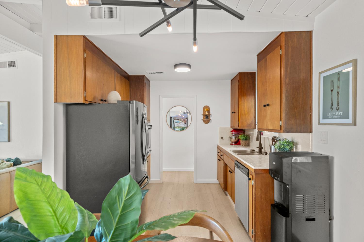 140 Rio Camino Street Auburn, CA 95603 - Photo 21 of 56 a kitchen with stainless steel appliances granite countertop a refrigerator a stove a sink a washer and dryer