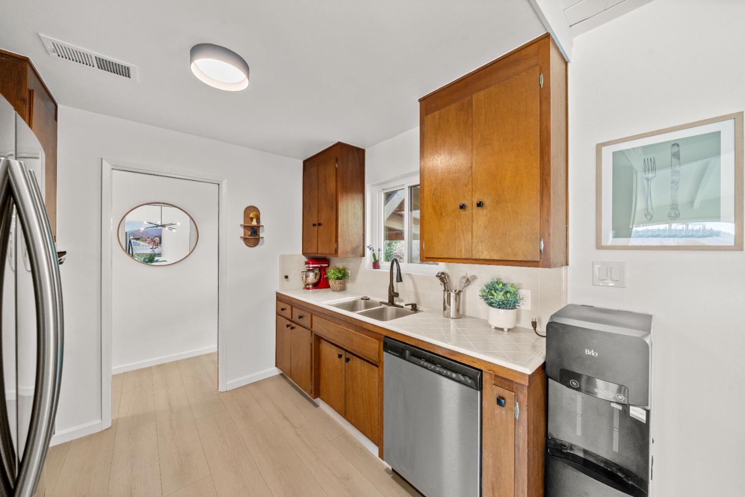 140 Rio Camino Street Auburn, CA 95603 - Photo 23 of 56 a bathroom with a double vanity sink and a mirror