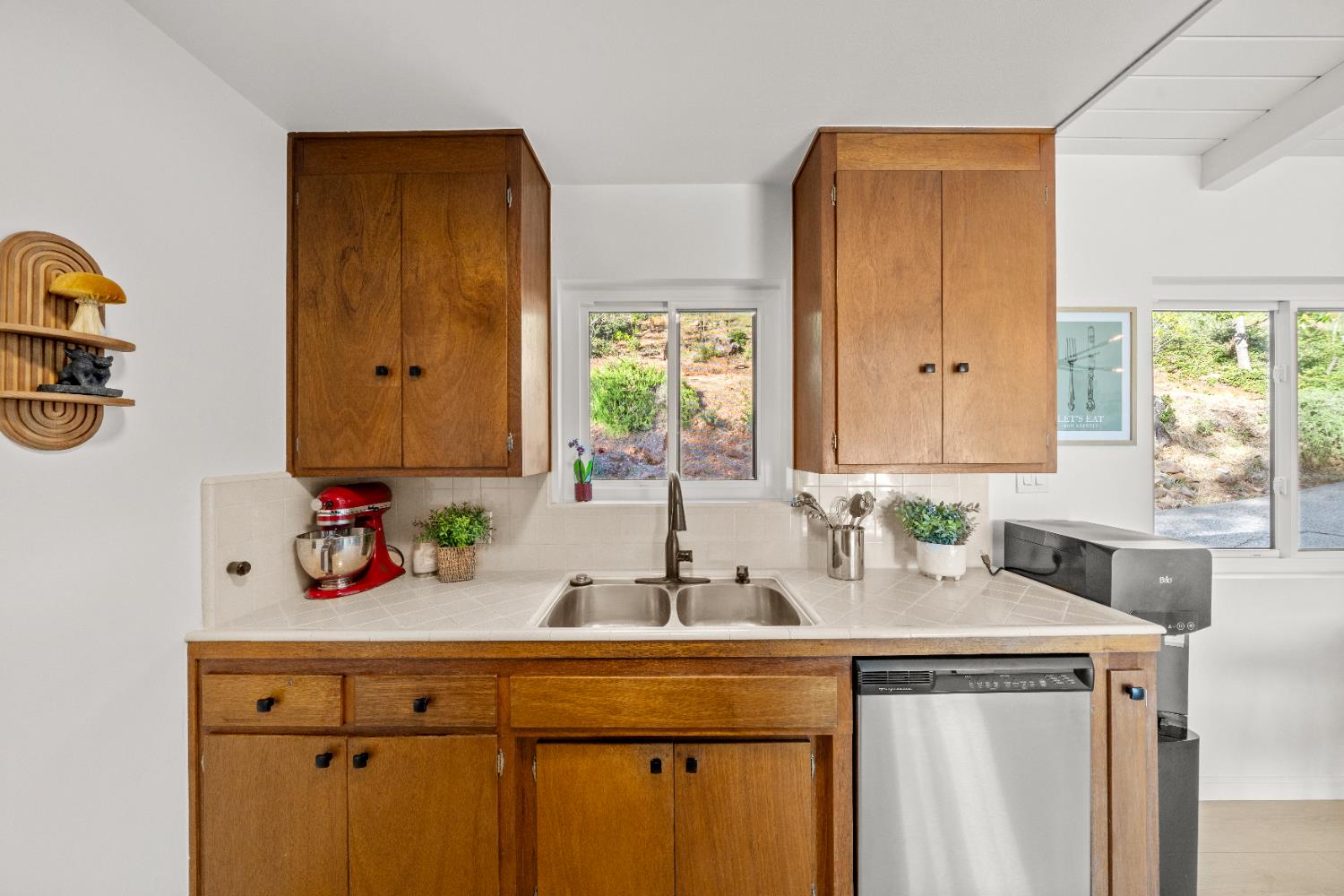 140 Rio Camino Street Auburn, CA 95603 - Photo 24 of 56 a kitchen with a sink cabinets and window