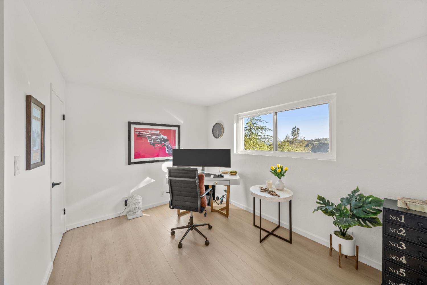 140 Rio Camino Street Auburn, CA 95603 - Photo 30 of 56 a view of a workspace with furniture and a potted plant