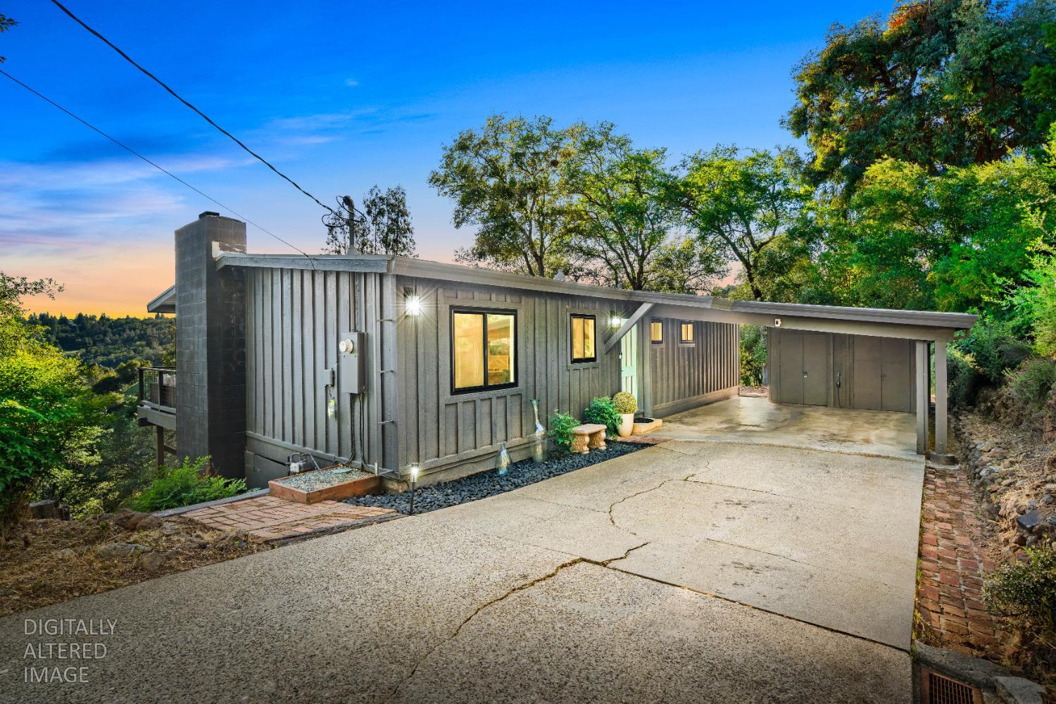 140 Rio Camino Street Auburn, CA 95603 - Photo 3 of 56 a view of a house with backyard and trees