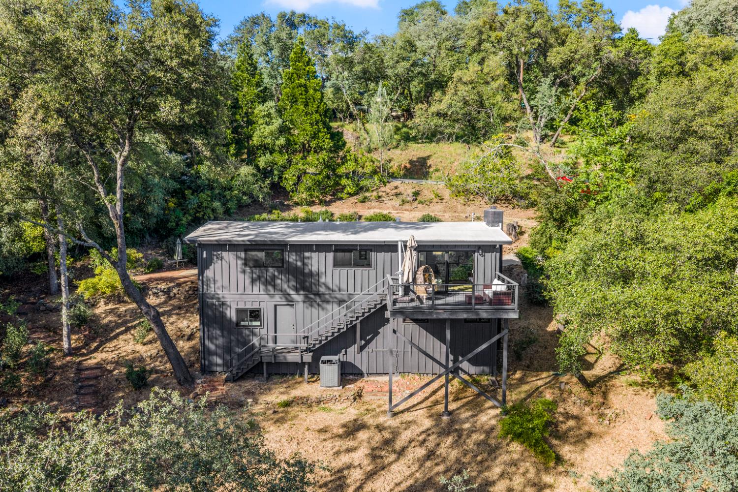 140 Rio Camino Street Auburn, CA 95603 - Photo 47 of 56 a view of a roof deck with wooden fence and bench
