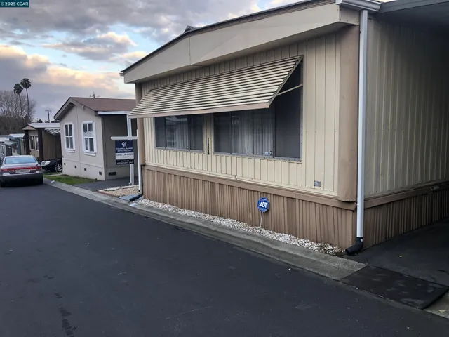 a view of a house with a street