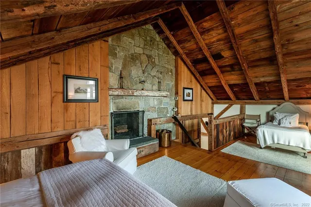 a bedroom with furniture or chandelier and a couch