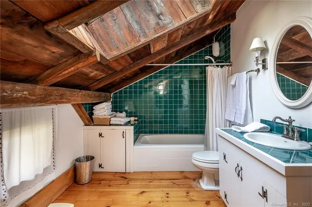 a view of bedroom with furniture and wooden floor
