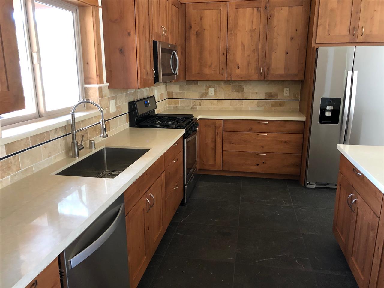16138 Lance Drive Truckee, CA 96161 - Photo 12 of 12 a kitchen with a sink stove and refrigerator