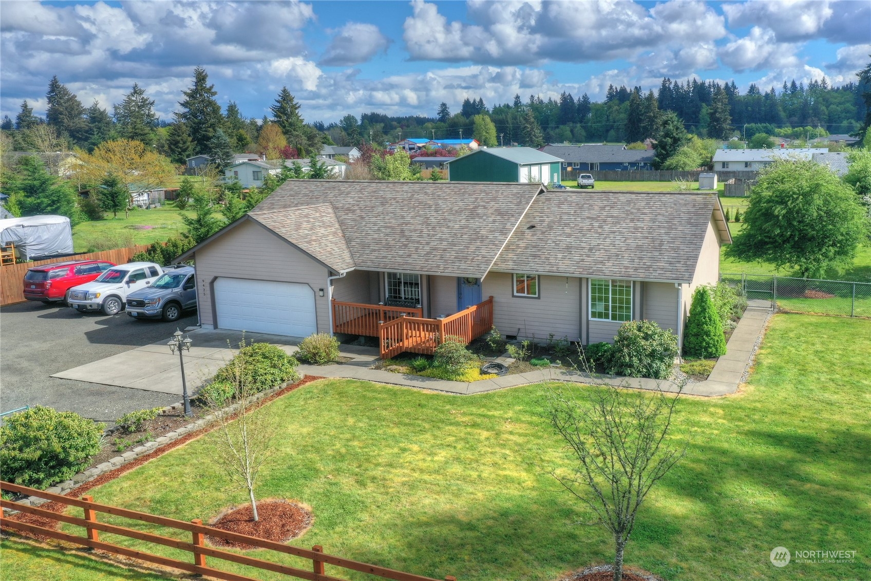 9425 180th Way Southwest Rochester, WA 98579 - Photo 1 of 37 a aerial view of a house with swimming pool and a yard