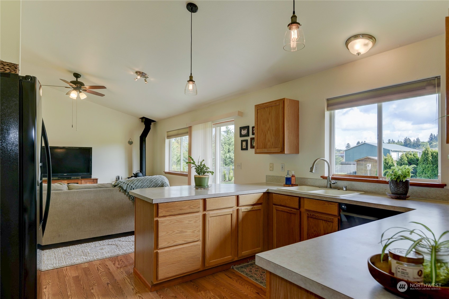 9425 180th Way Southwest Rochester, WA 98579 - Photo 12 of 37 a kitchen with sink stove and refrigerator