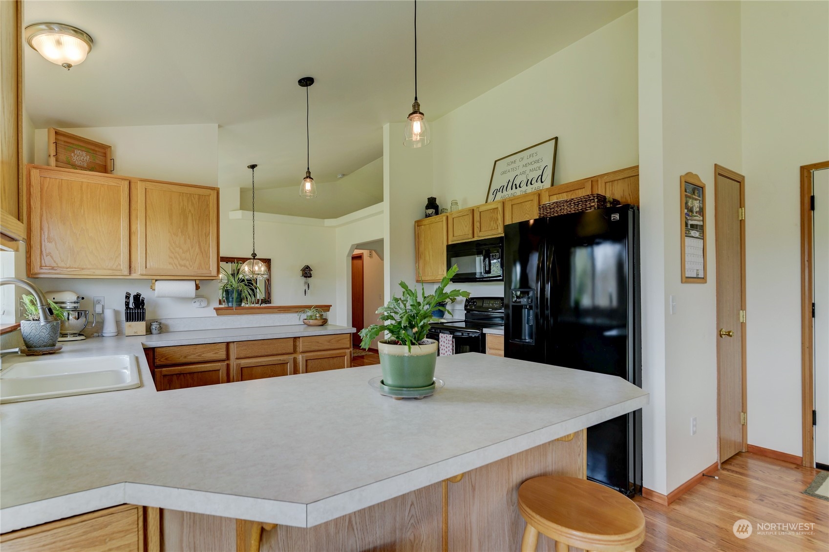 9425 180th Way Southwest Rochester, WA 98579 - Photo 13 of 37 a kitchen with a refrigerator and a sink