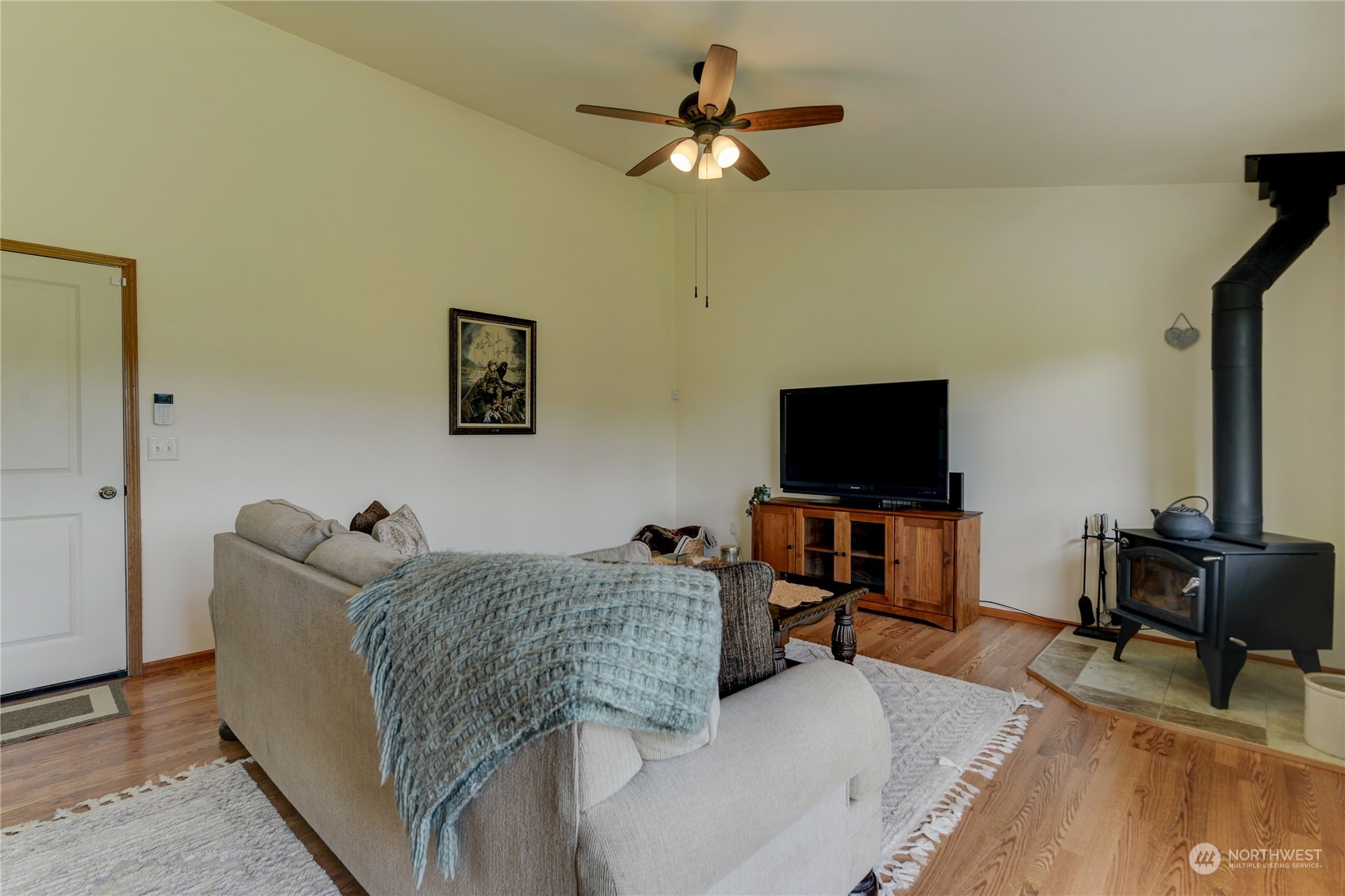 9425 180th Way Southwest Rochester, WA 98579 - Photo 16 of 37 a living room with furniture and a flat screen tv