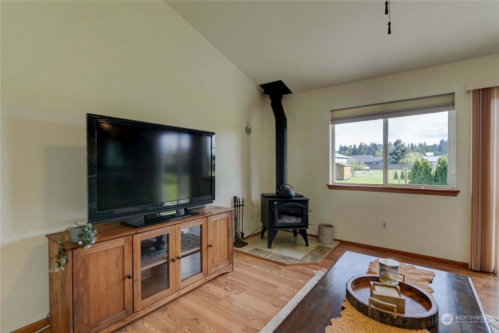 9425 180th Way Southwest Rochester, WA 98579 - Photo 18 of 37 a room with furniture and a flat screen tv