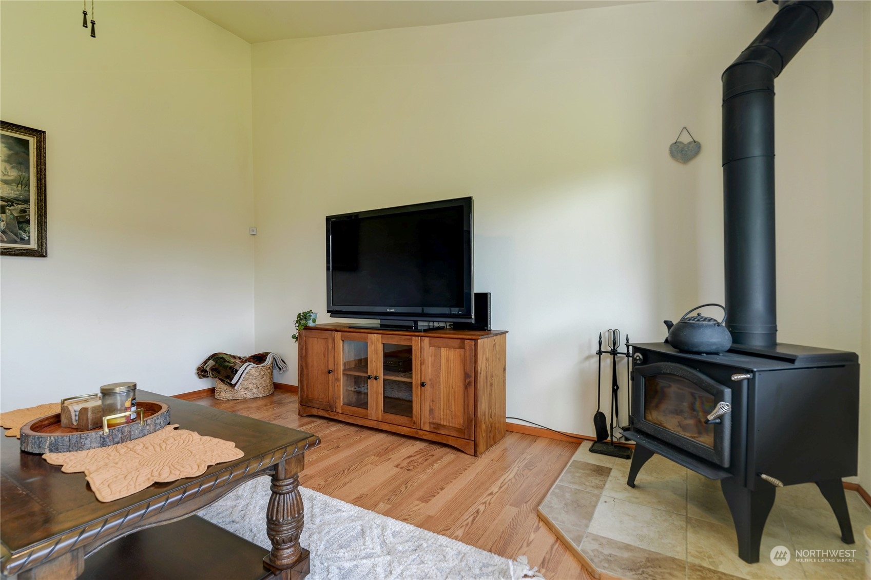 9425 180th Way Southwest Rochester, WA 98579 - Photo 19 of 37 a living room with furniture and a flat screen tv