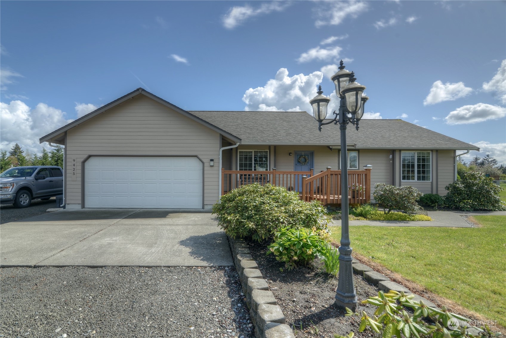 9425 180th Way Southwest Rochester, WA 98579 - Photo 2 of 37 a front view of a house with garden