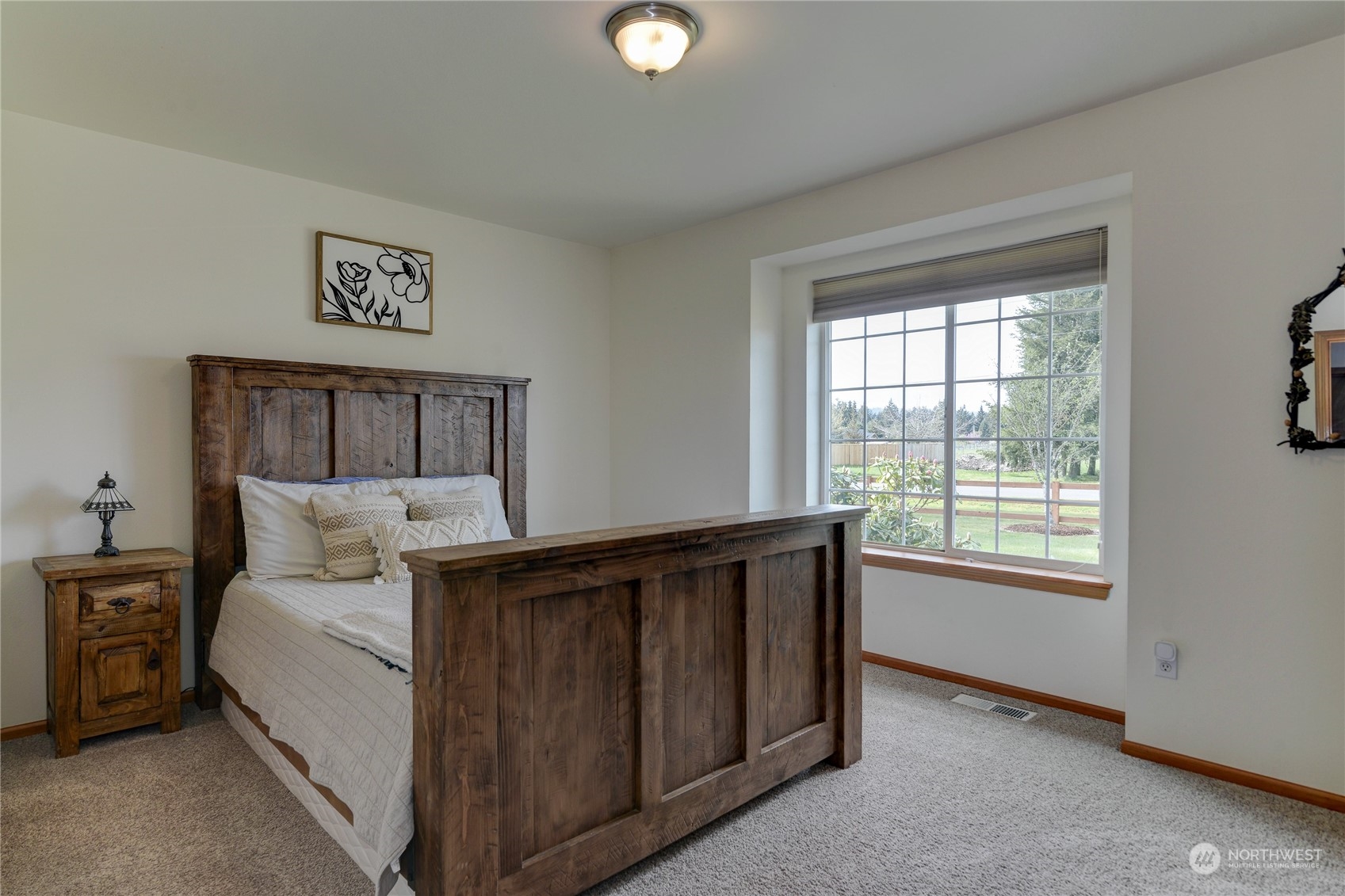 9425 180th Way Southwest Rochester, WA 98579 - Photo 21 of 37 a bedroom with a bed and a window