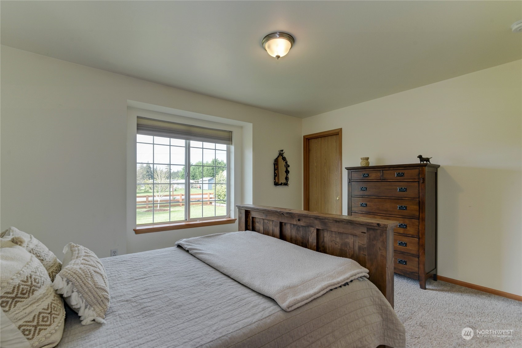 9425 180th Way Southwest Rochester, WA 98579 - Photo 22 of 37 a bedroom with a bed and a dresser