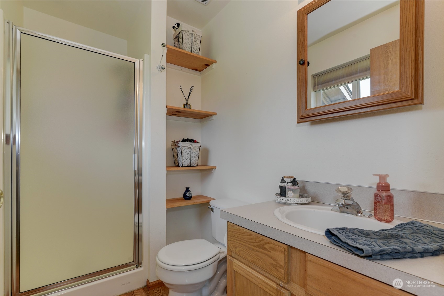 9425 180th Way Southwest Rochester, WA 98579 - Photo 24 of 37 a bathroom with a granite countertop sink toilet and a mirror
