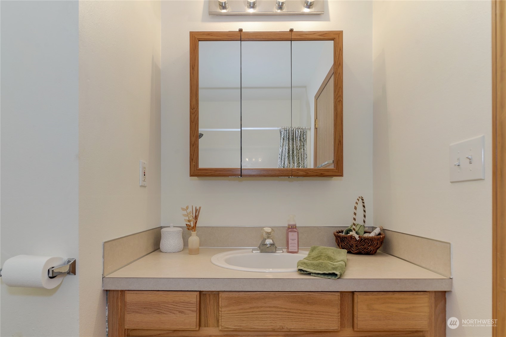 9425 180th Way Southwest Rochester, WA 98579 - Photo 25 of 37 a bathroom with a sink and a mirror