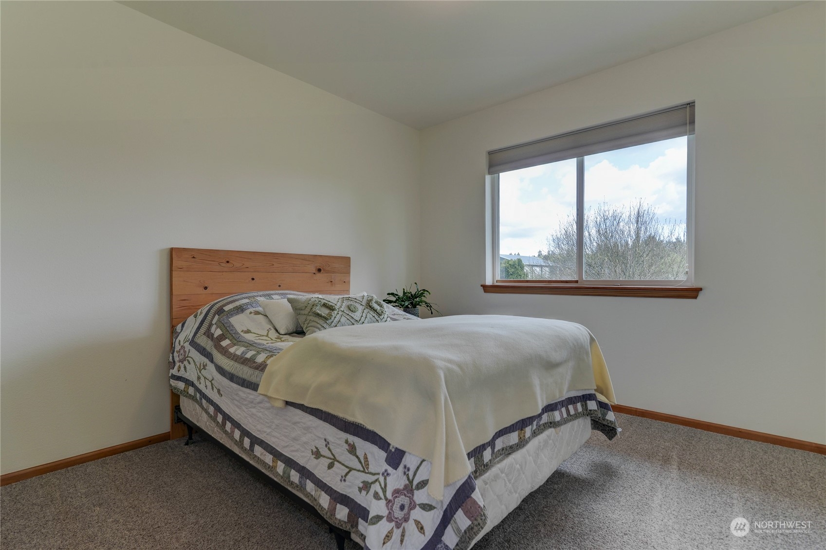 9425 180th Way Southwest Rochester, WA 98579 - Photo 26 of 37 a bedroom with a bed and window