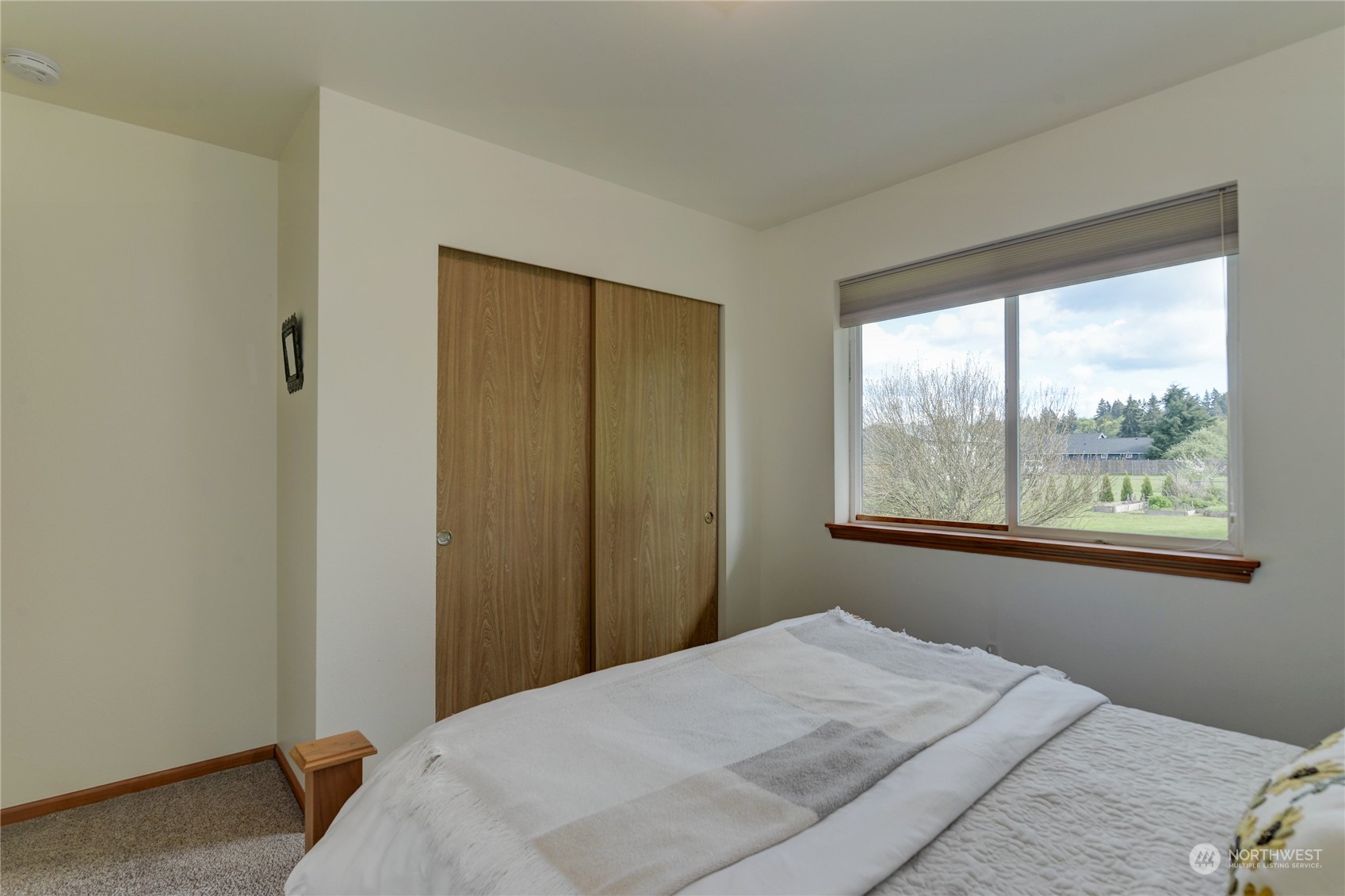 9425 180th Way Southwest Rochester, WA 98579 - Photo 27 of 37 a bedroom with a bed and window