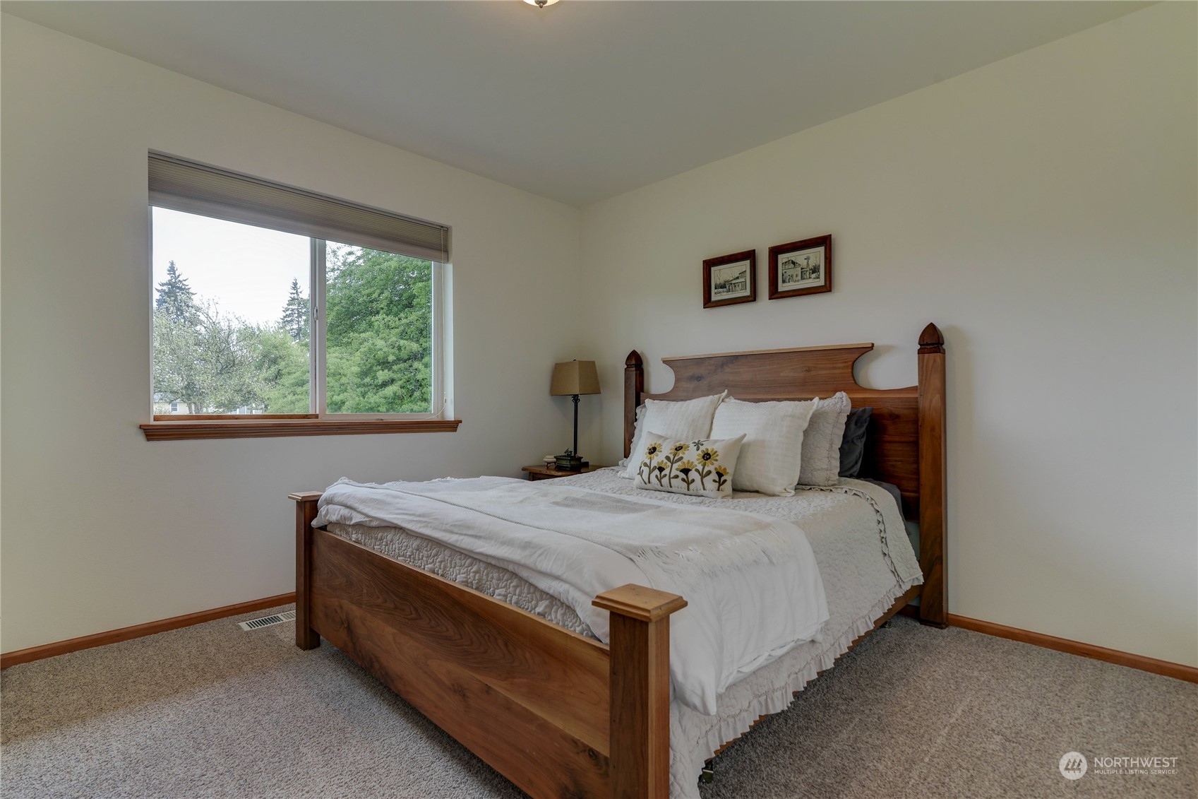 9425 180th Way Southwest Rochester, WA 98579 - Photo 28 of 37 a bed sitting in a bedroom next to a window