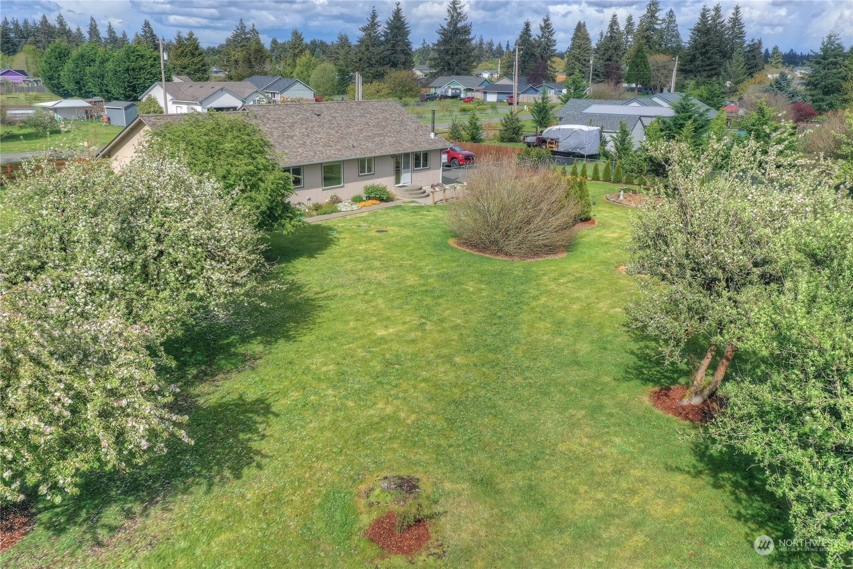 9425 180th Way Southwest Rochester, WA 98579 - Photo 29 of 37 an aerial view of residential house with outdoor space and trees all around
