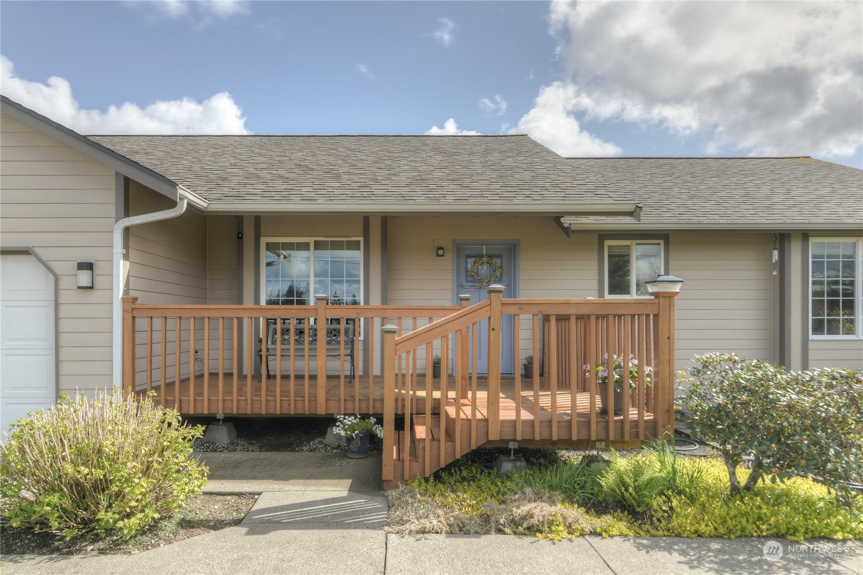 9425 180th Way Southwest Rochester, WA 98579 - Photo 3 of 37 a view of a house with a small yard and plants