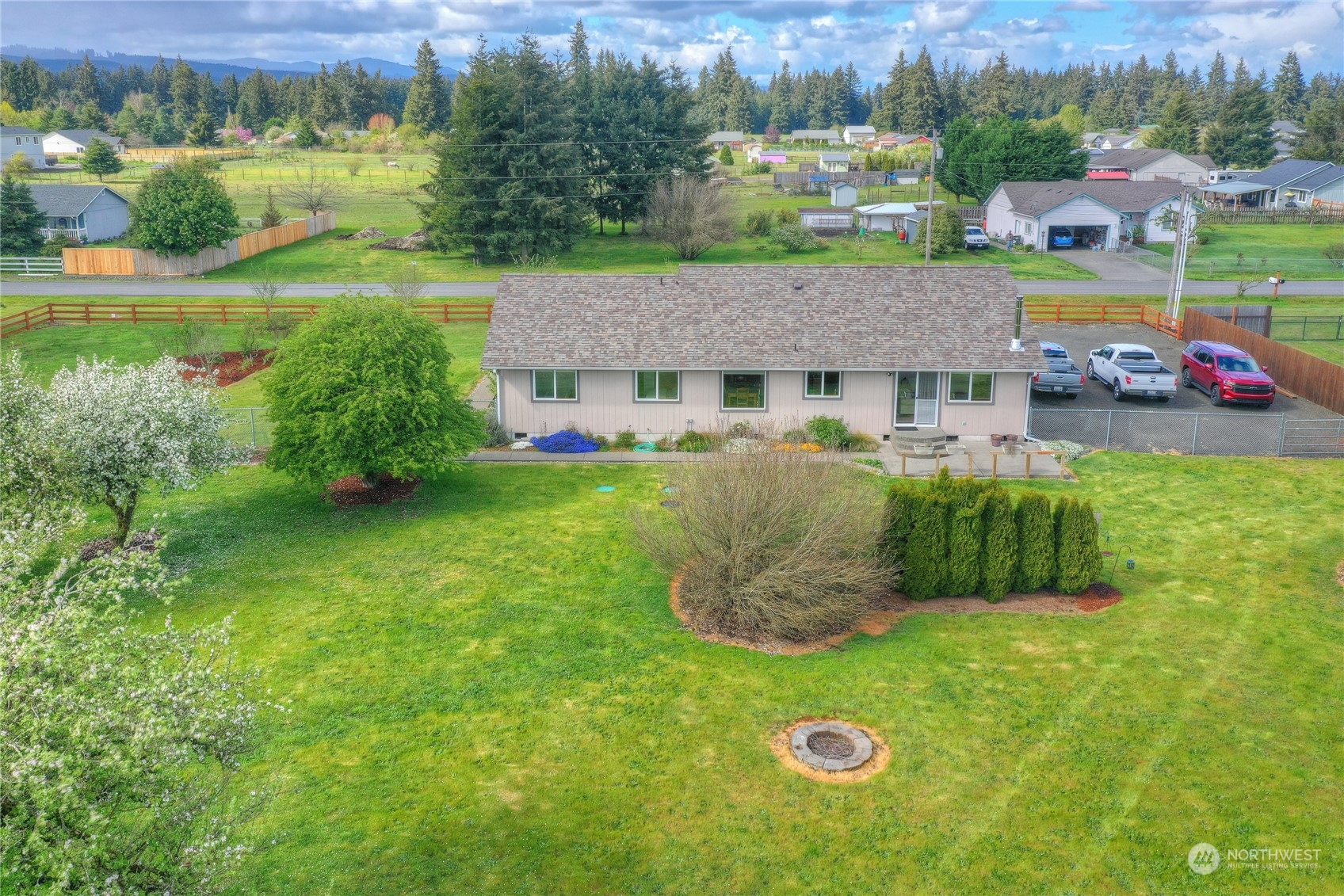 9425 180th Way Southwest Rochester, WA 98579 - Photo 33 of 37 an aerial view of a house with a garden and a yard