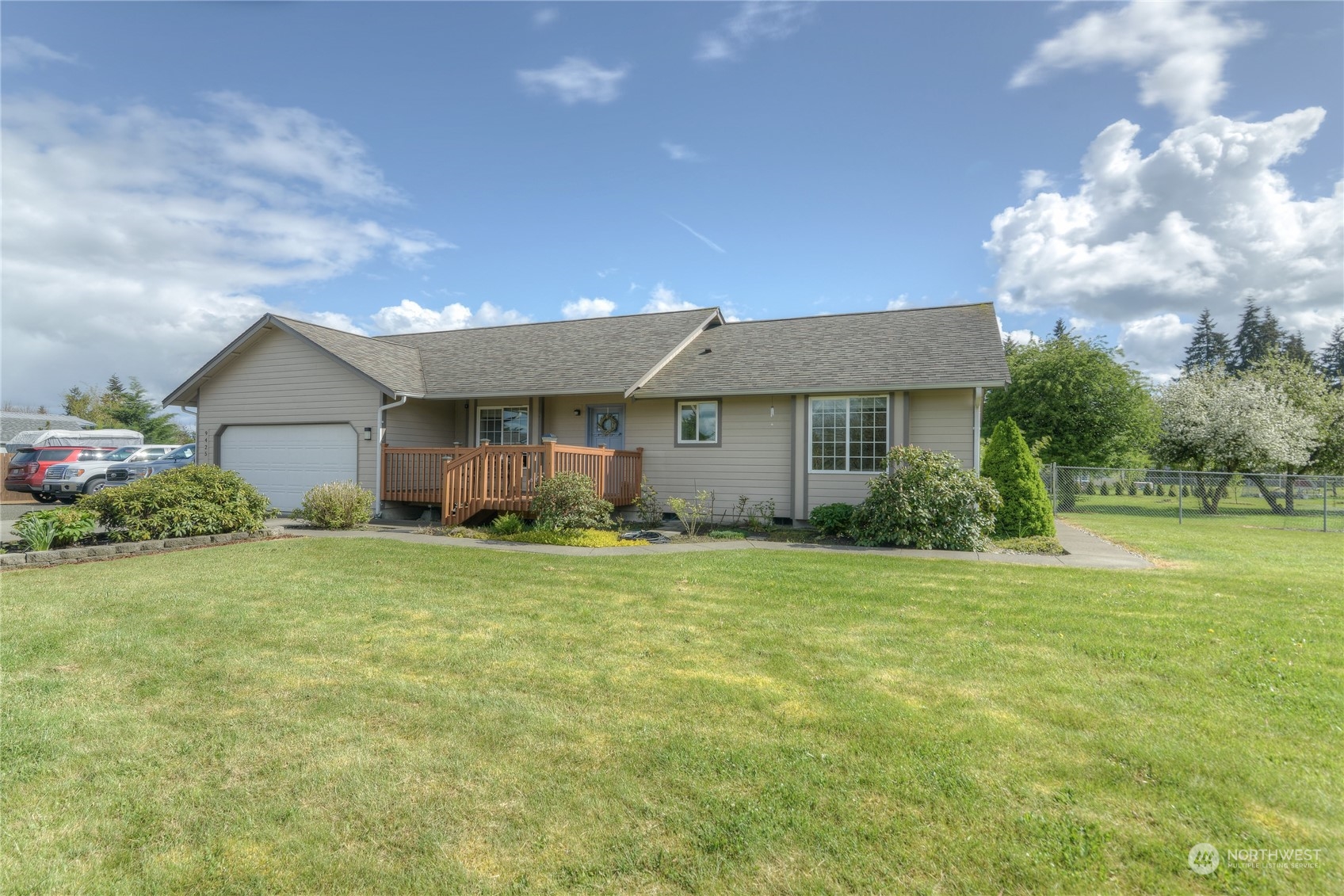 9425 180th Way Southwest Rochester, WA 98579 - Photo 5 of 37 a front view of house with deck and yard