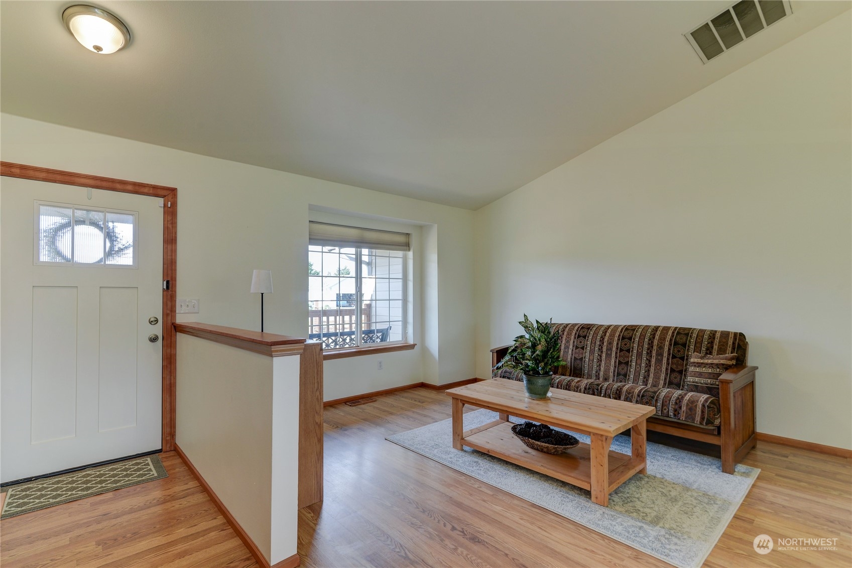 9425 180th Way Southwest Rochester, WA 98579 - Photo 6 of 37 a living room with furniture rug and wooden floor