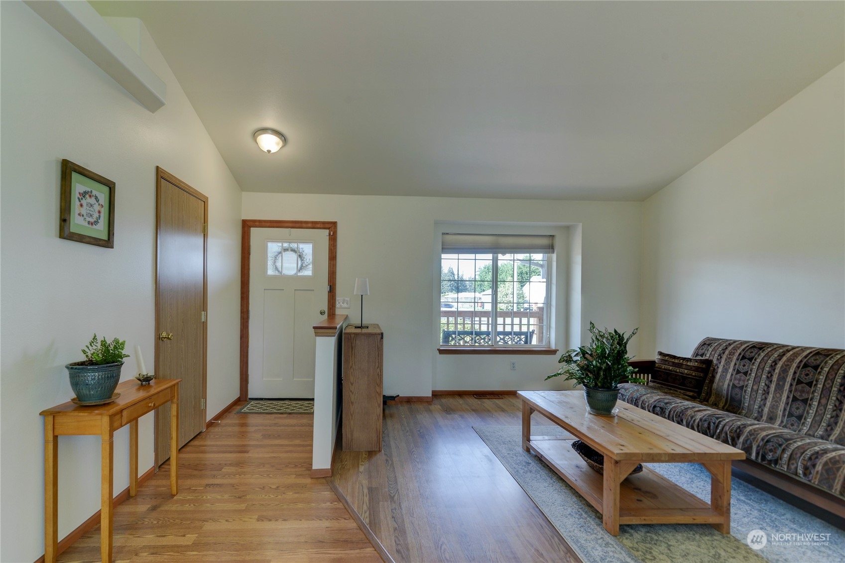 9425 180th Way Southwest Rochester, WA 98579 - Photo 7 of 37 a living room with furniture and wooden floor