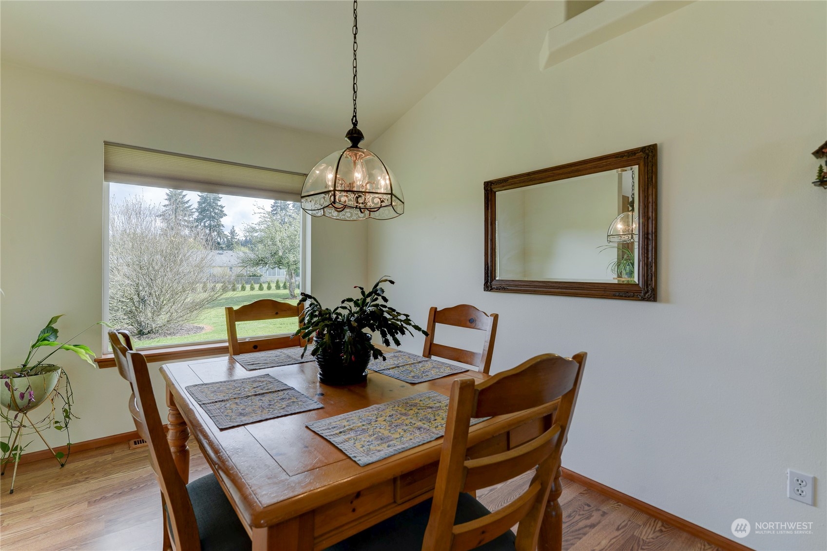 9425 180th Way Southwest Rochester, WA 98579 - Photo 10 of 37 a view of a dining room with furniture window and wooden floor