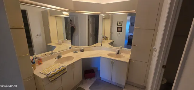 a bathroom with a sink and mirror