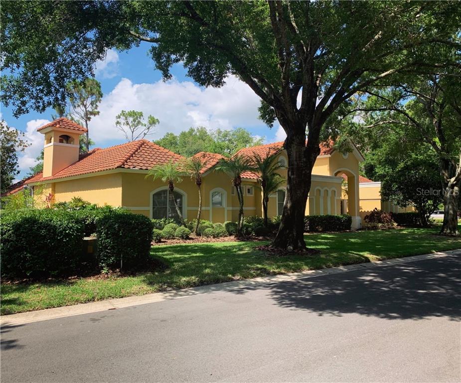 9400 Sloane Street Orlando, FL 32827 - Photo 1 of 1 a front view of a house with a yard and a garage