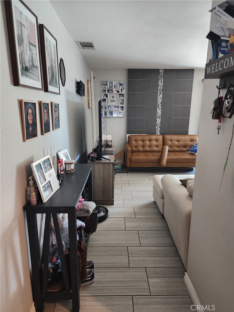 3316 Joel Drive Riverside, CA 92509 - Photo 5 of 6 a bedroom with furniture and a couch