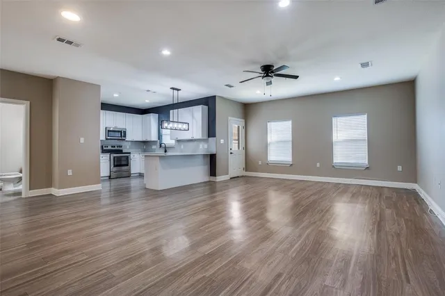 wooden floor in kitchen and a kitchen with a hard wood floor