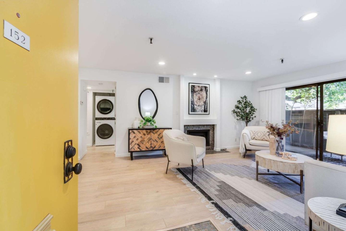 49 Showers Drive, Unit E152 Mountain View, CA 94040 - Photo 14 of 27 a living room with furniture and a window